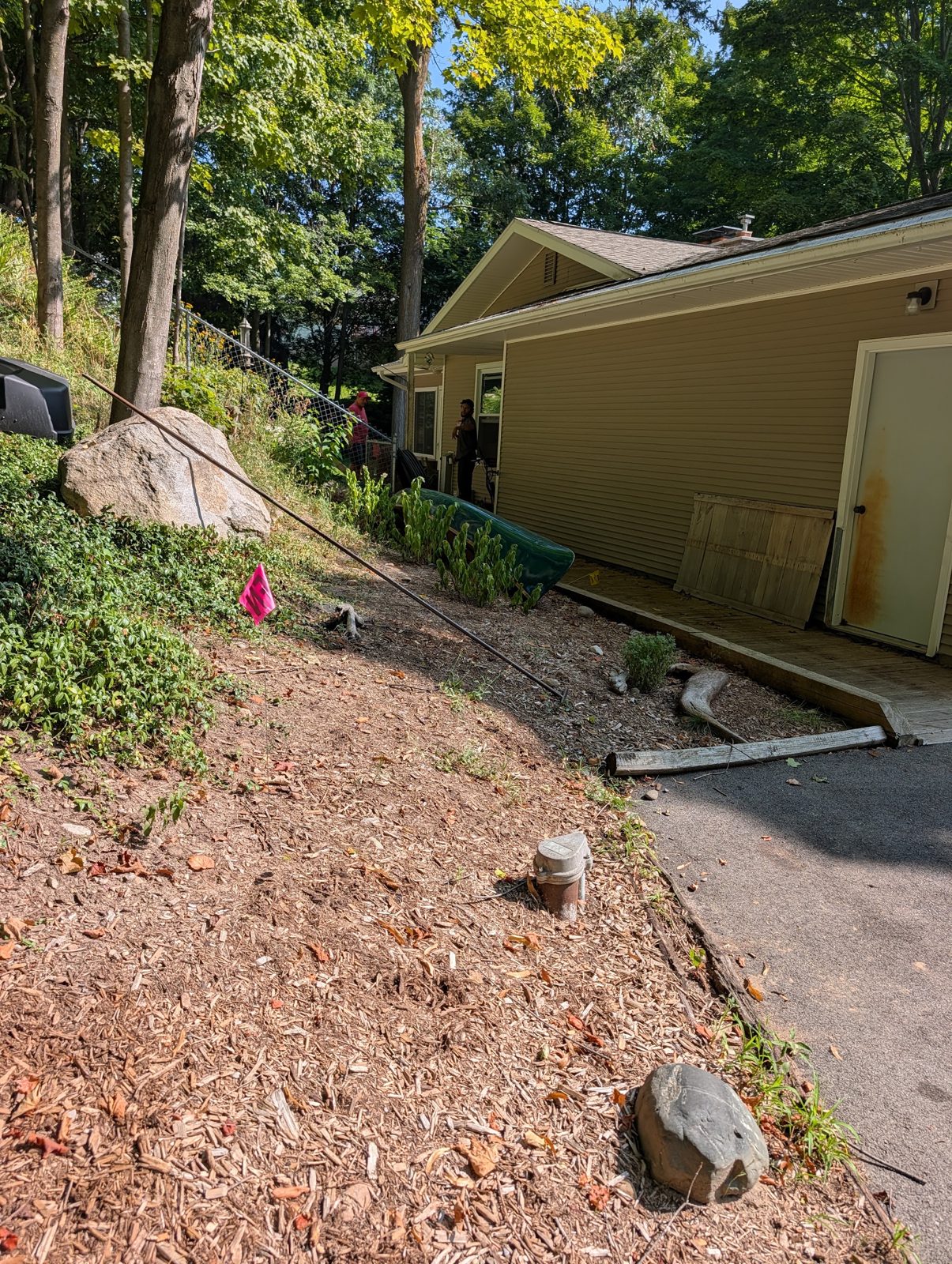 Wooded hillside with landscaping intact while the bore passes underneath